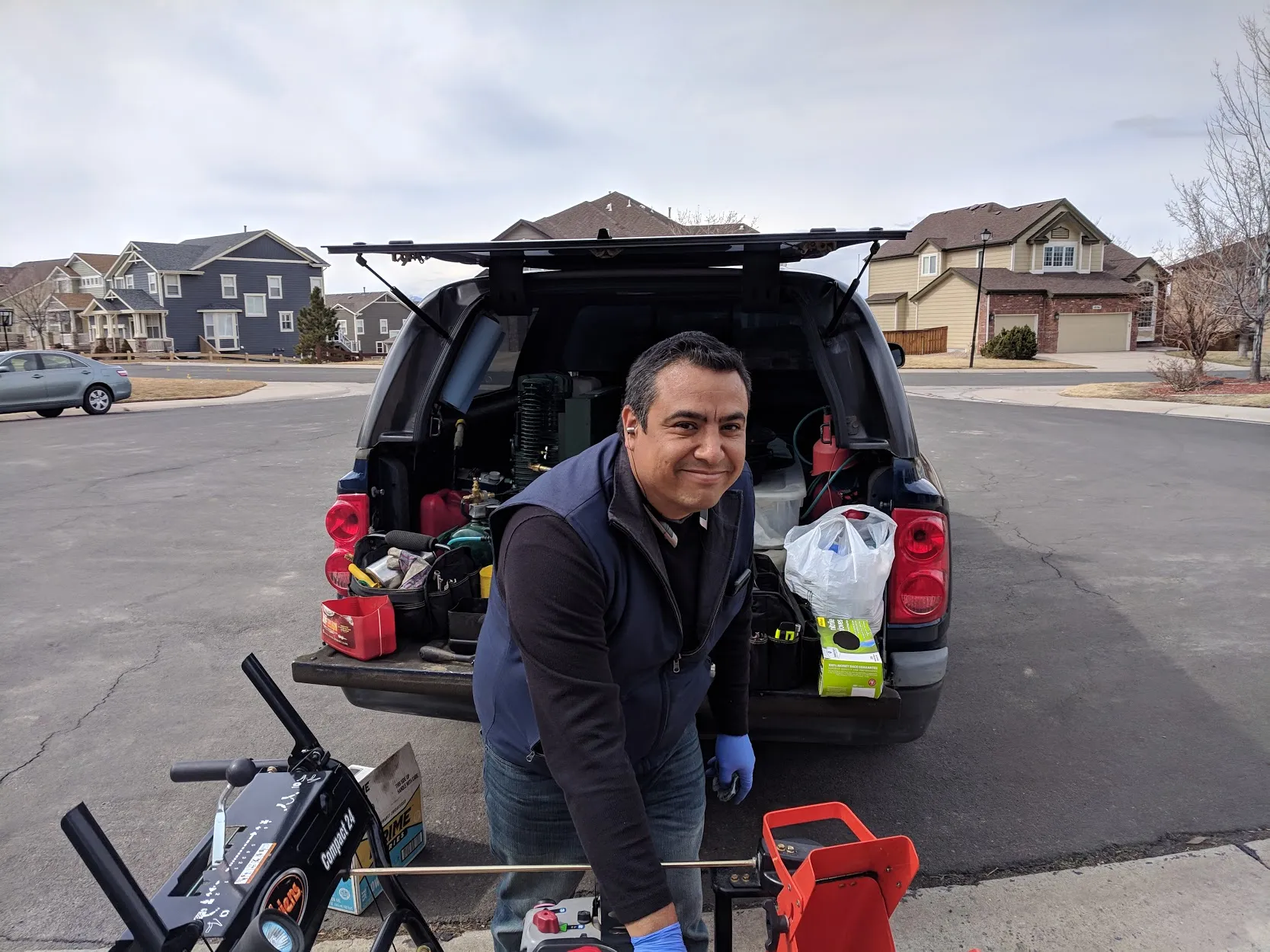 David, certified small engine repair tech, at work in Denver Metro